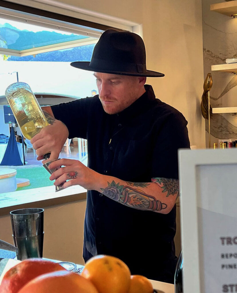 Cameron preparing a cocktail