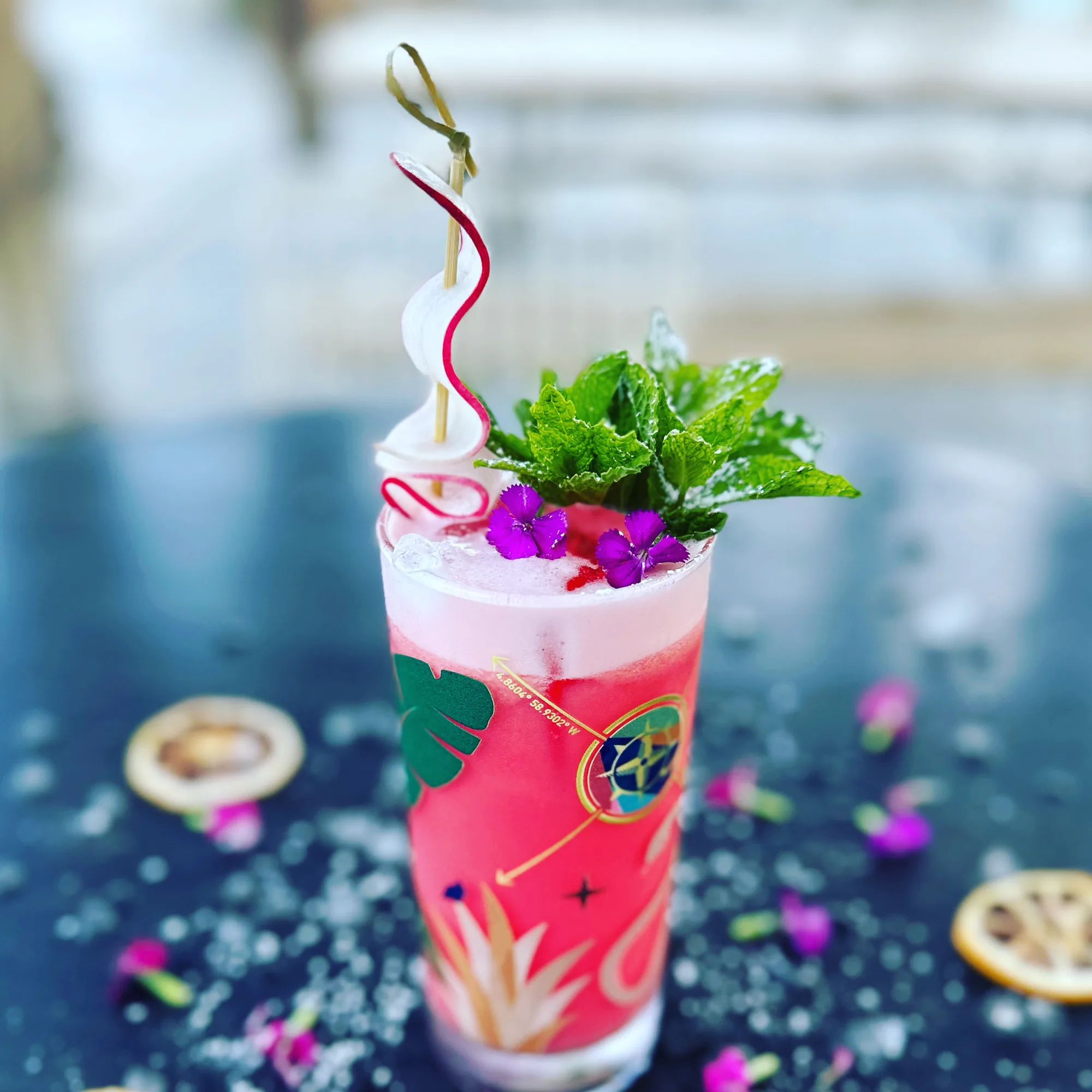 A colorful tropical cocktail with fresh garnish.