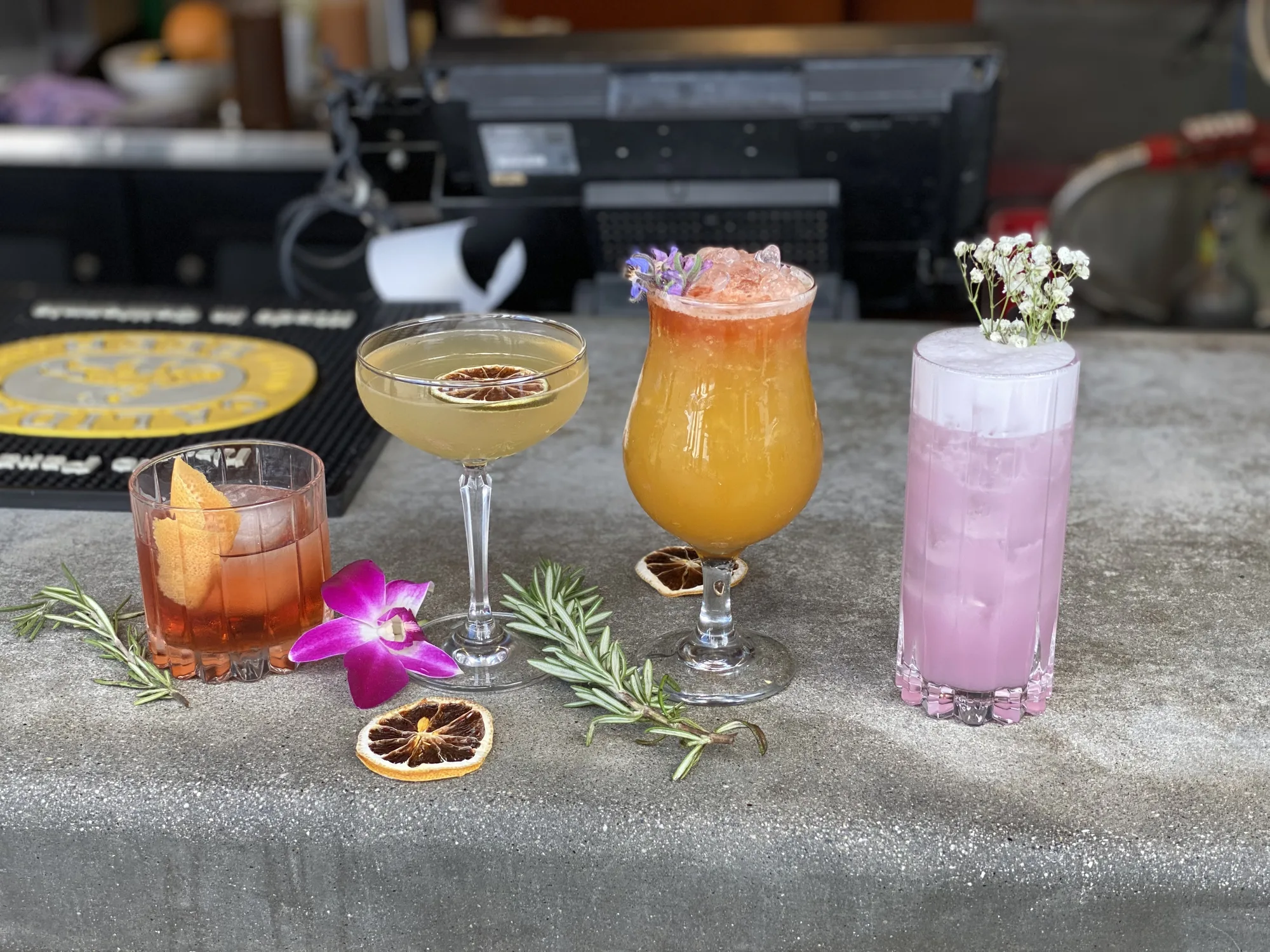 A lineup of signature cocktails prepared for an event.